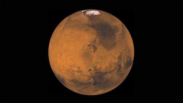A red planet with a white polar ice cap against a black background.